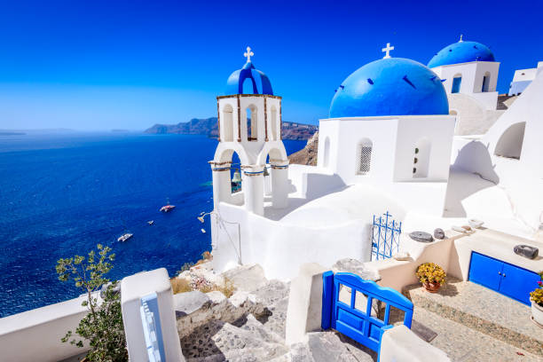 Oia, Santorini, Greece - Blue church and caldera Oia, Santorini - Greece. Famous attraction of white village with cobbled streets, Greek Cyclades Islands, Aegean Sea. fira santorini stock pictures, royalty-free photos & images
