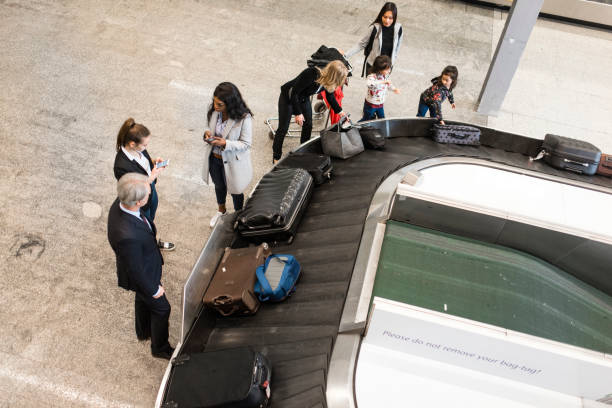 istock People picking up their luggage from the baggage carousel 1027016074