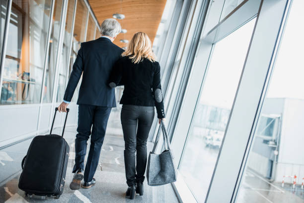 istock Business people walking towards the plane 1027016302