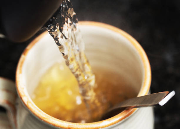 Mixing beef stock powder with boiling water