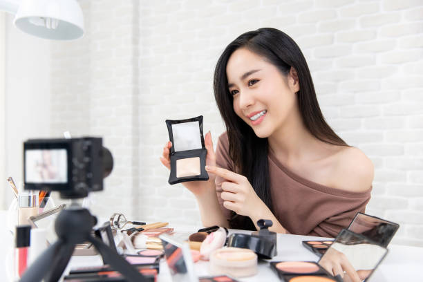 istock Asian woman professional beauty vlogger recording cosmetic makeup tutorial video 1027019458