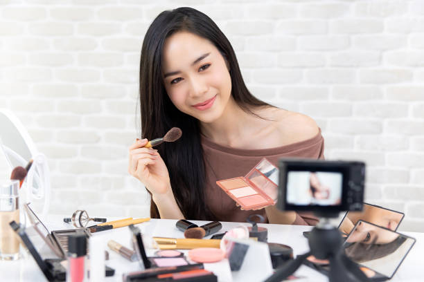 istock Beautiful Asian woman professional beauty vlogger recording makeup tutorial video 1027019460