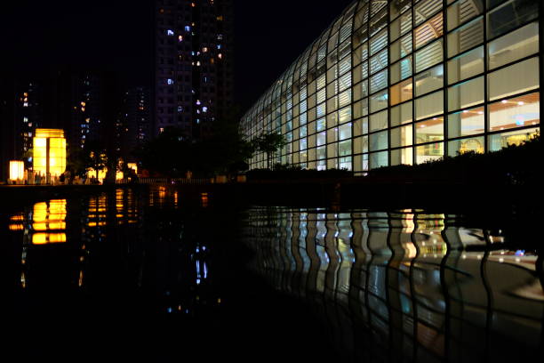 istock Night view of architecture building with tree and pool 1027019786