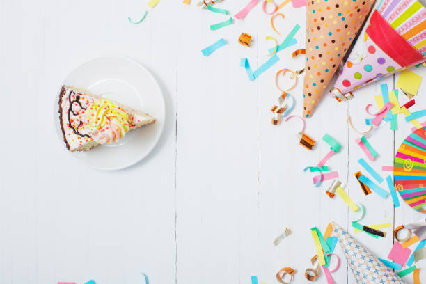 istock birthday cake and  decoration on white wooden background 1027020180