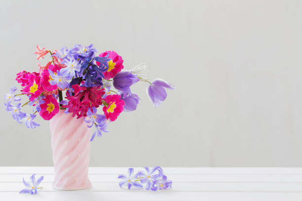 istock beautiful spring flowers in pink vase 1027020256