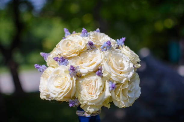 istock Wedding bouquet on the grass, roses and lavender. 1027023068