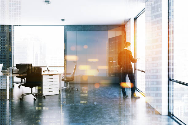 istock Man in white modern company office interior 1027023282