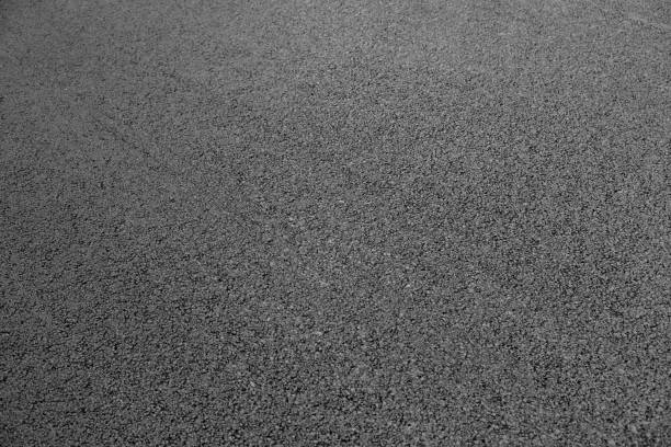 istock New black asphalt close up. 1027026470