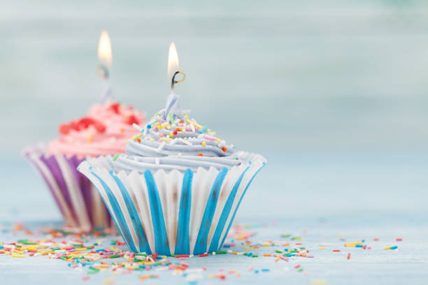 istock Sweet cupcakes with candles 1027026544