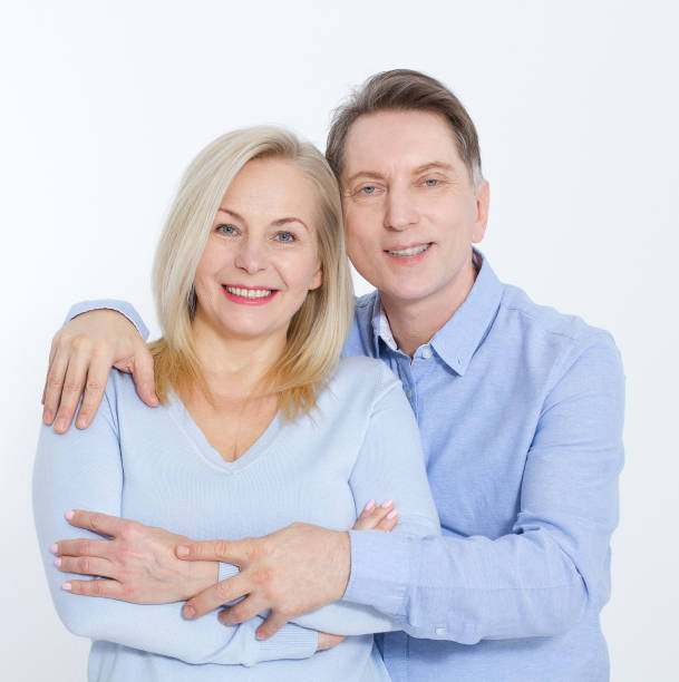 istock Middle aged Couple portrait isolated on white background. 1027029674