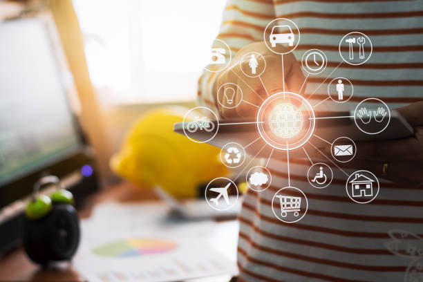 istock Architecture in casual dress holding tablet with online while making orders with virtual icon diagram in office. 1027029880