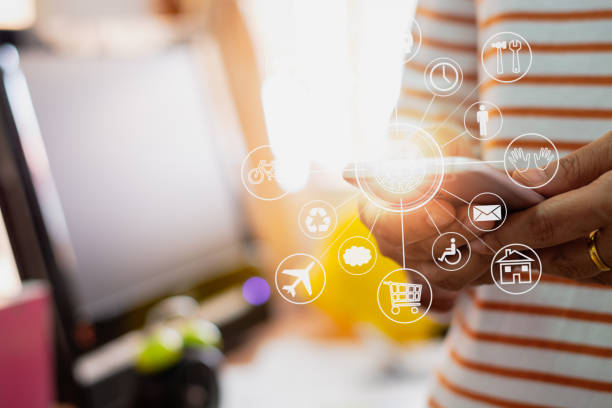 istock Architecture in casual dress holding mobile phone with online while making orders with virtual icon diagram in office. 1027030034