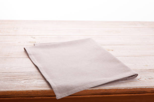 istock Empty wooden table with tablecloth. Napkin close up top view mock up. Kitchen rustic background. 1027033778