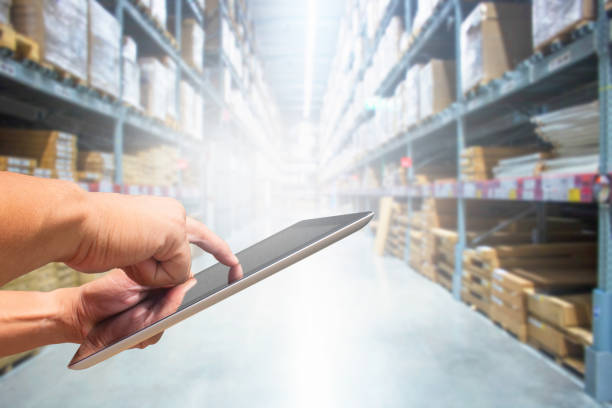istock check stock tablet hand in warehouse store 1027036510