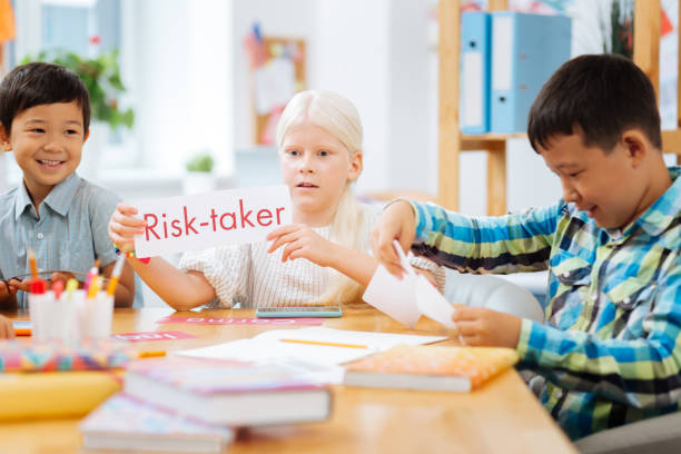 istock Pretty girl playing with the classmates at school 1027036936