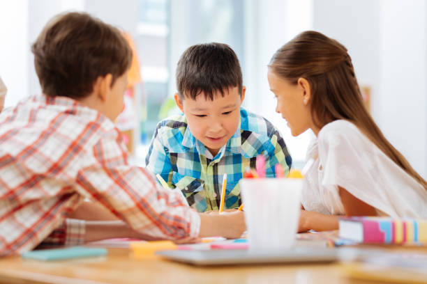 istock Attentive children being concentrated on drawing a picture 1027037256