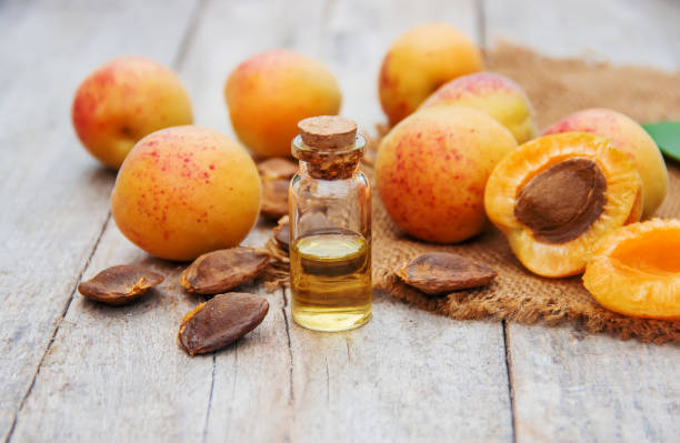 apricot oil in a small jar. selective focus. apricot oil in a small jar. selective focus. nature. apricot stock pictures, royalty-free photos & images