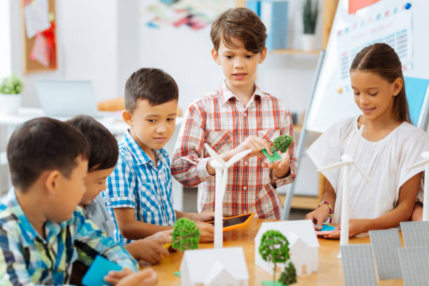 istock Thoughtful children dicsussing the task in a classroom 1027040128