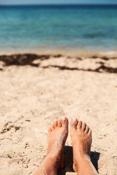 istock Relaxing on beautiful beach near turquoise sea. 1027040390