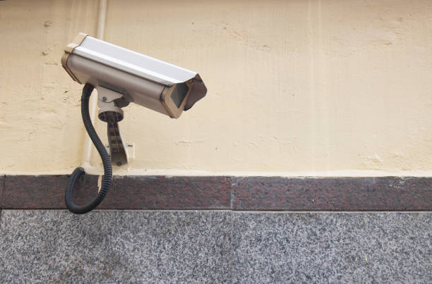 istock cctv camera protect crime on wall house 1027040806