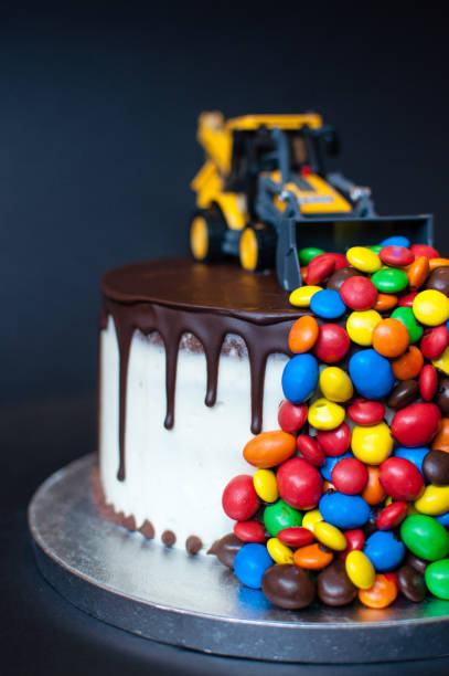 istock Birthday chocolate cake with tractor on top 1027043750