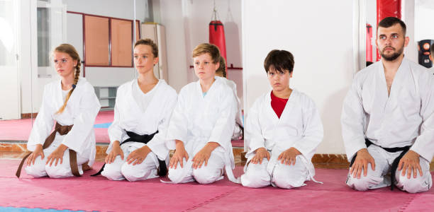 istock Kids taekwondo group ready to practice 1027051330