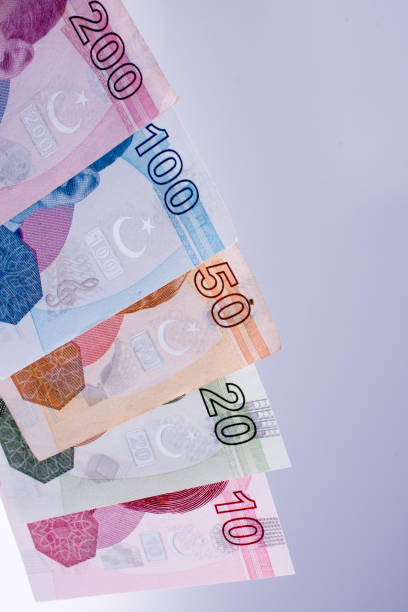 istock American dollar banknotes and Turksh Lira banknotes side by side 1027051564
