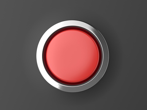 Botón rojo brillante con elementos metálicos aislados en fondo negro photo