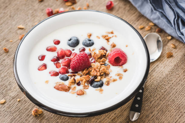 istock Greek yogurt with granola, pomegranate, blueberry, raspberry 1027056728