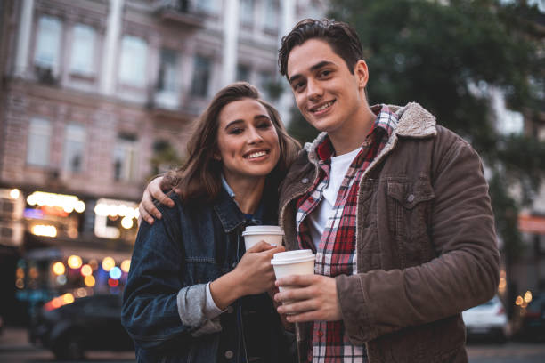 istock Joyful young people embracing on street 1027058850