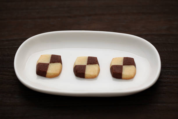 istock milk butter chocolate cookies isolated on plate on wood table 1027058926