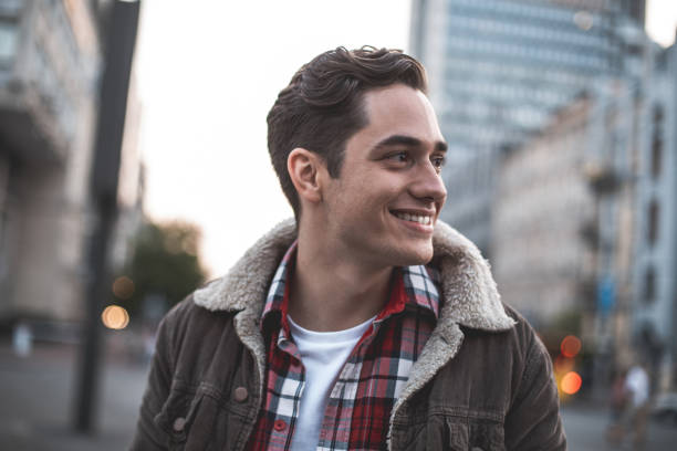 istock Delighted young man enjoying leisure outside 1027058982