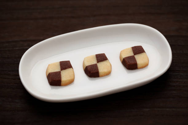 istock milk butter chocolate cookies isolated on plate on wood table 1027059040