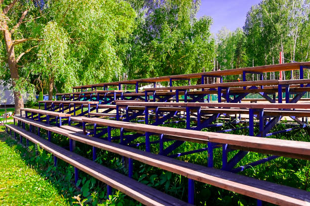 Wooden bleachers for fans the summer the sun pictured in the photo Wooden bleachers for fans the summer wooden bleachers stock pictures, royalty-free photos & images