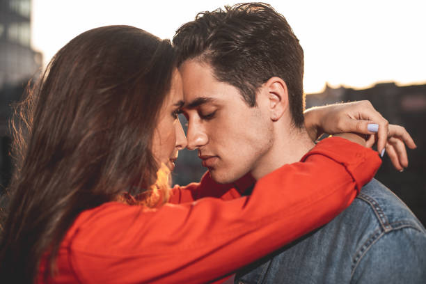 istock Loving couple hugging on street 1027059710