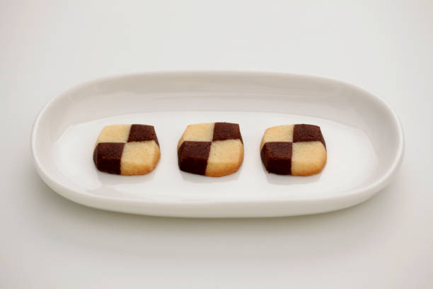 istock milk butter chocolate cookies isolated on plate on white background 1027060066