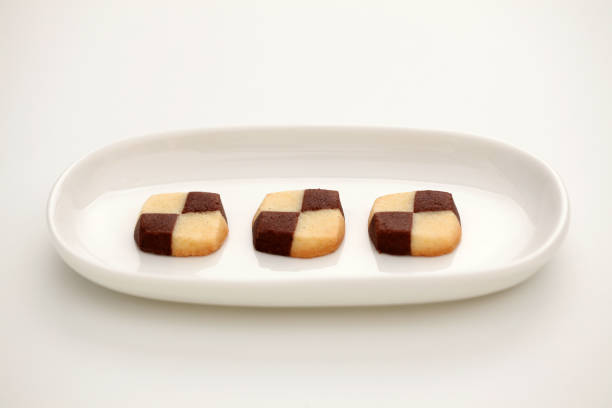 istock milk butter chocolate cookies isolated on plate on white background 1027062690