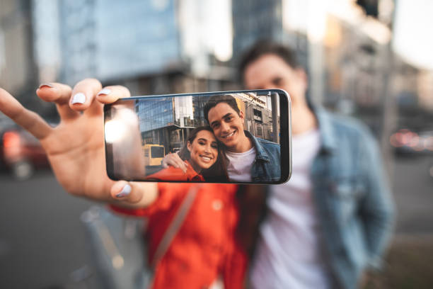 istock Loving couple bonding to each other on street 1027063498