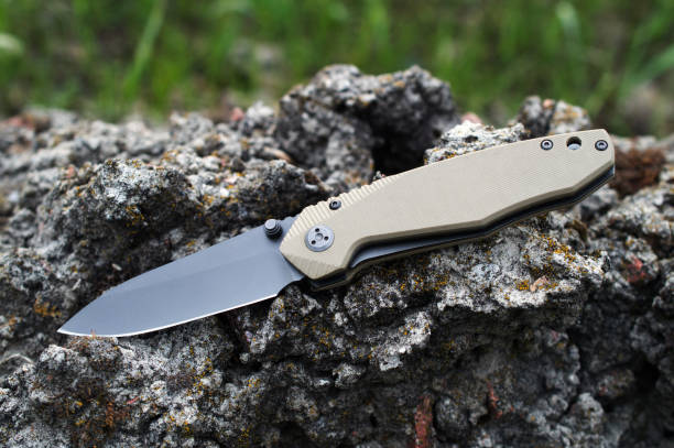 istock Folding tourist, camping knife with black blade and handle made 1027063994