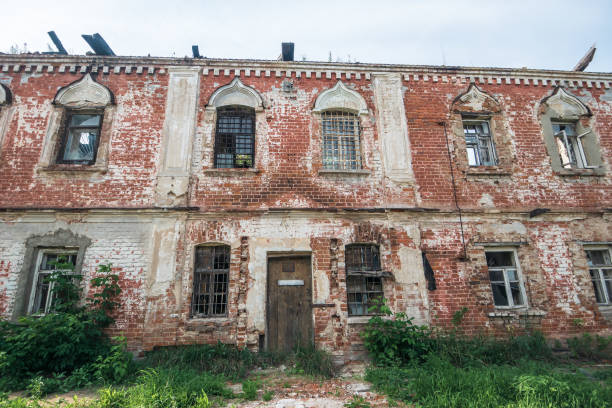 istock Old ruins of abandoned ruined red brick building 1027078758