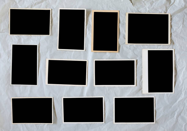 istock old empty photo frames, vintage photo prints  with free pics space 1027079018