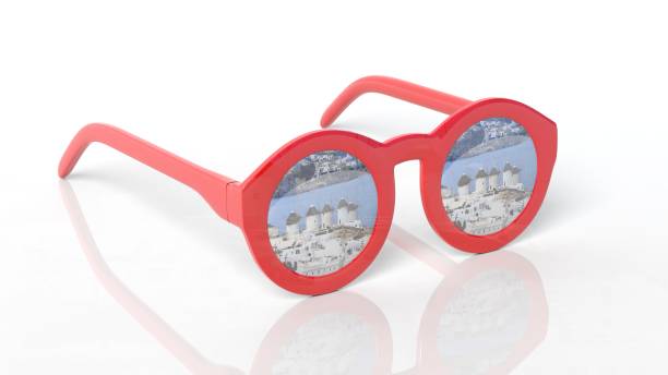 istock Red round-lens sunglasses with Mykonos Greece reflection on lens , isolated on white background. 1027079448