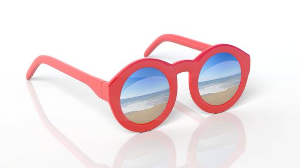 istock Red round-lens sunglasses with sandy beach reflection on lens , isolated on white background. 1027079450