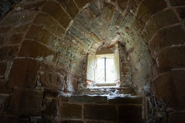 istock Old stone build window showing key stone structure and design 1027082738