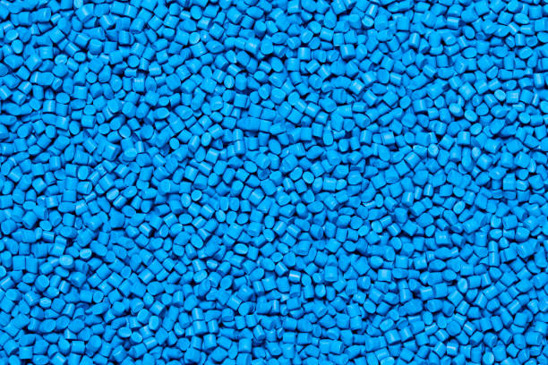 Close up of a blue plastic polypropylene granules Close up Flat lay of a blue plastic polypropylene granules on a table, copy space polymer stock pictures, royalty-free photos & images
