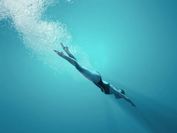 istock Woman swimming underwater in a sea. 1027085888