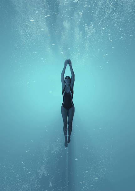istock Woman swimming underwater in a sea. 1027085890
