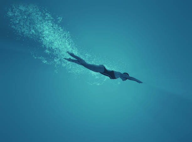 istock Woman swimming underwater in a sea. 1027085896