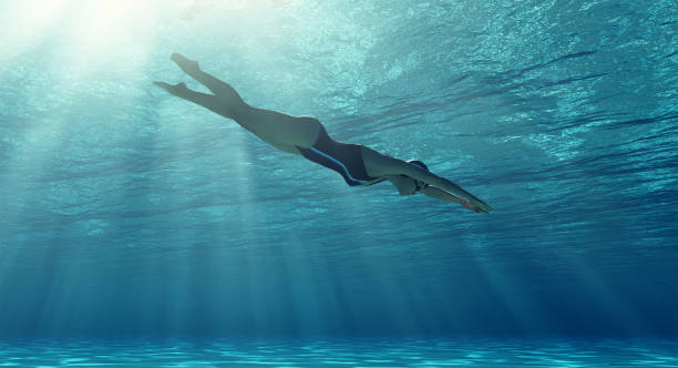 istock Woman swimming underwater in a sea. 1027086034