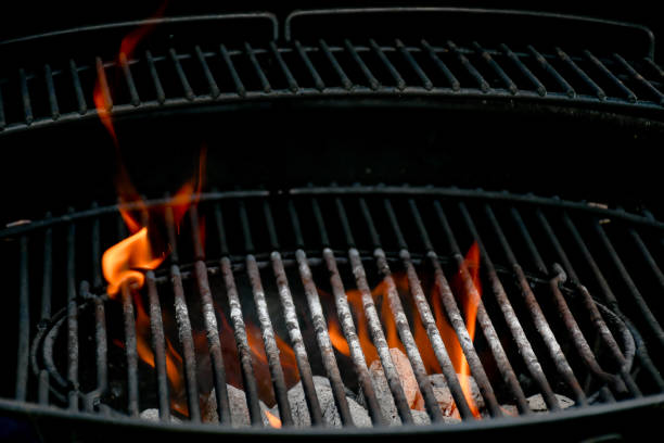 Empty  barbecue grills two step with  flaming charcoal stock photo